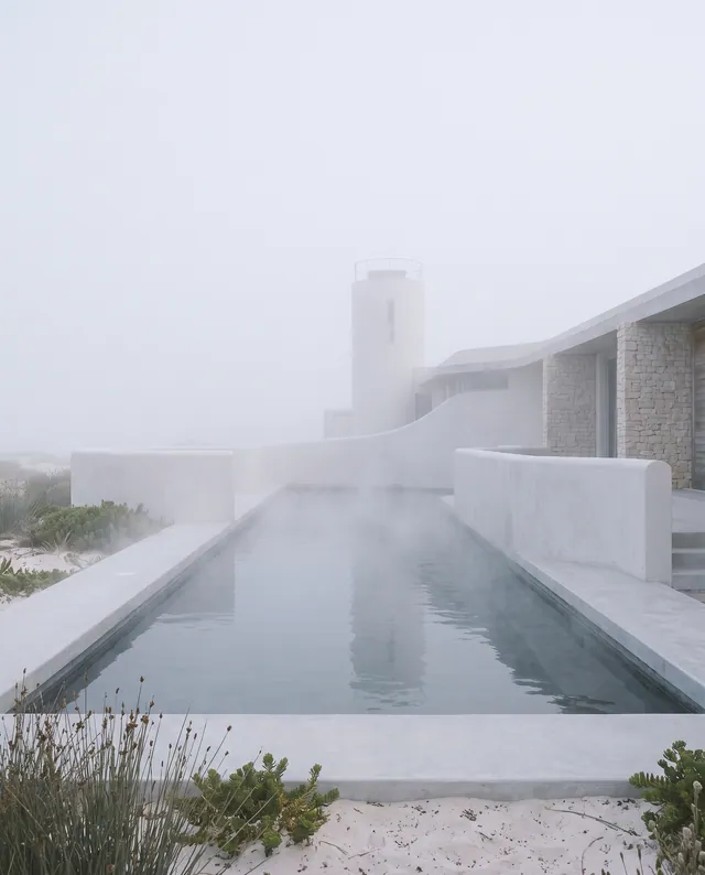 The heated pool steaming in the fog